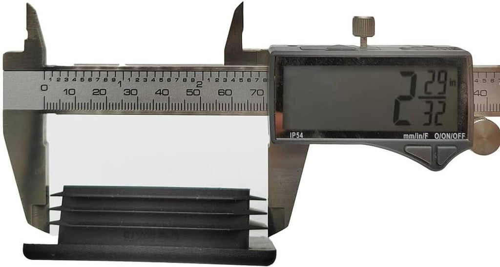 Black rectangular plastic plug insert measured with a caliper for fit