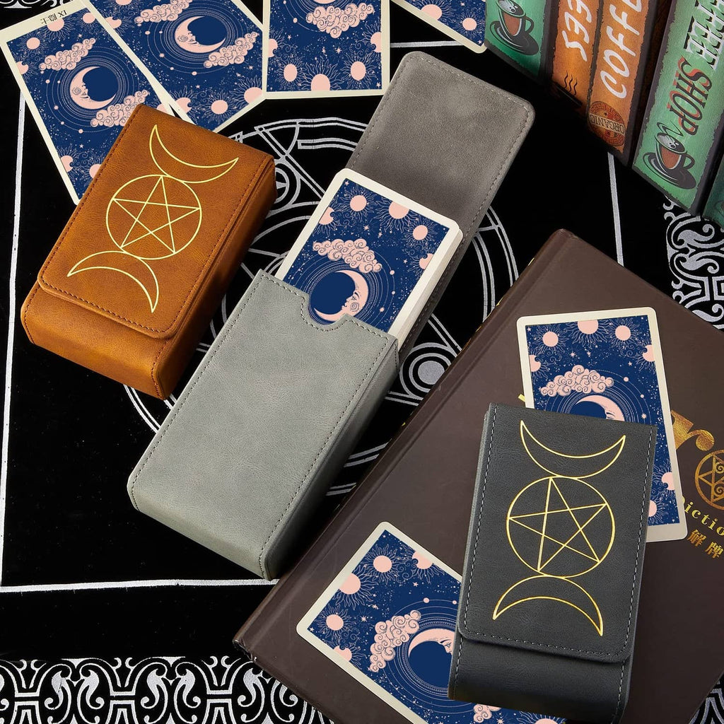 Set of tarot card cases with gold symbols on brown and gray covers