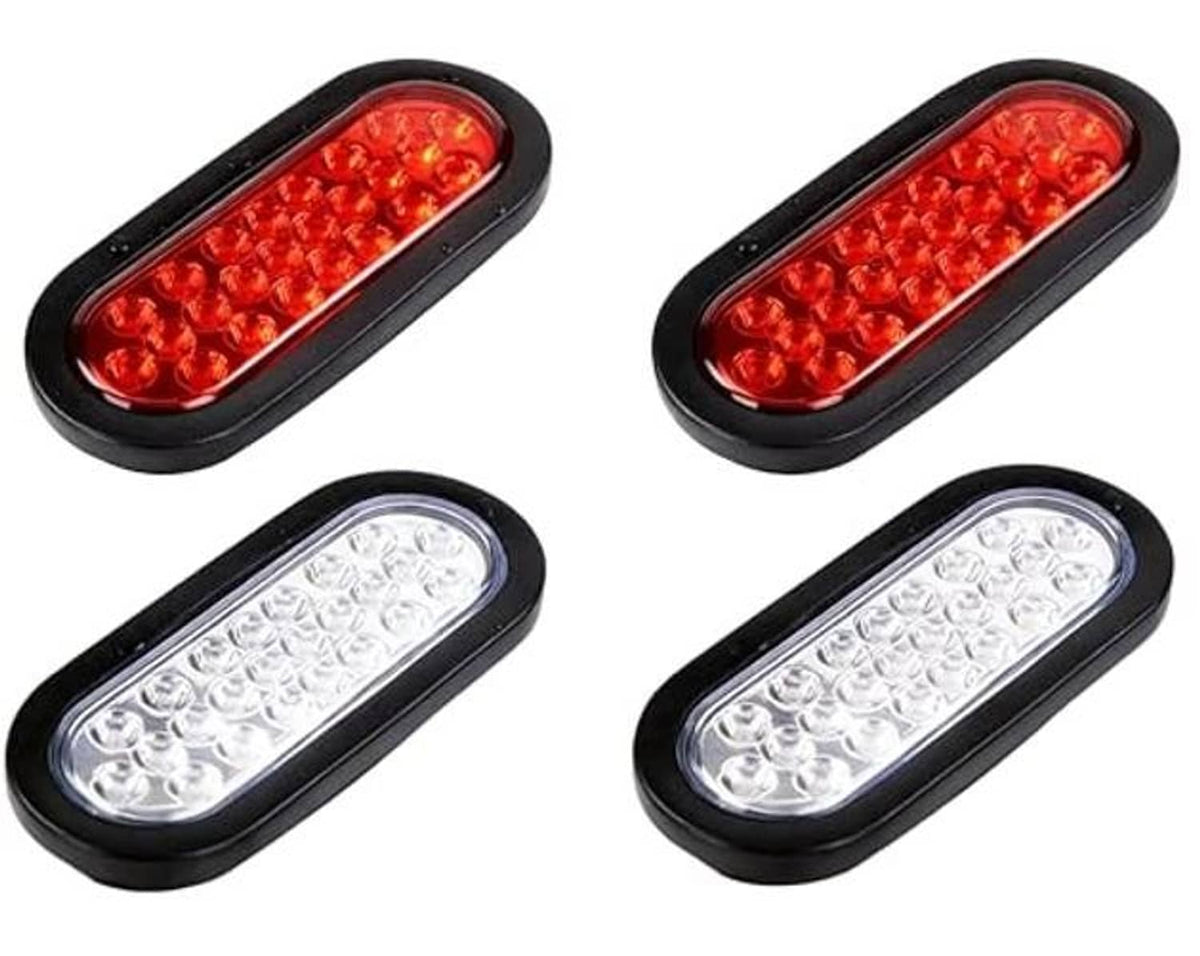 Set of oval LED trailer tail lights, black housing, red and clear lens pair