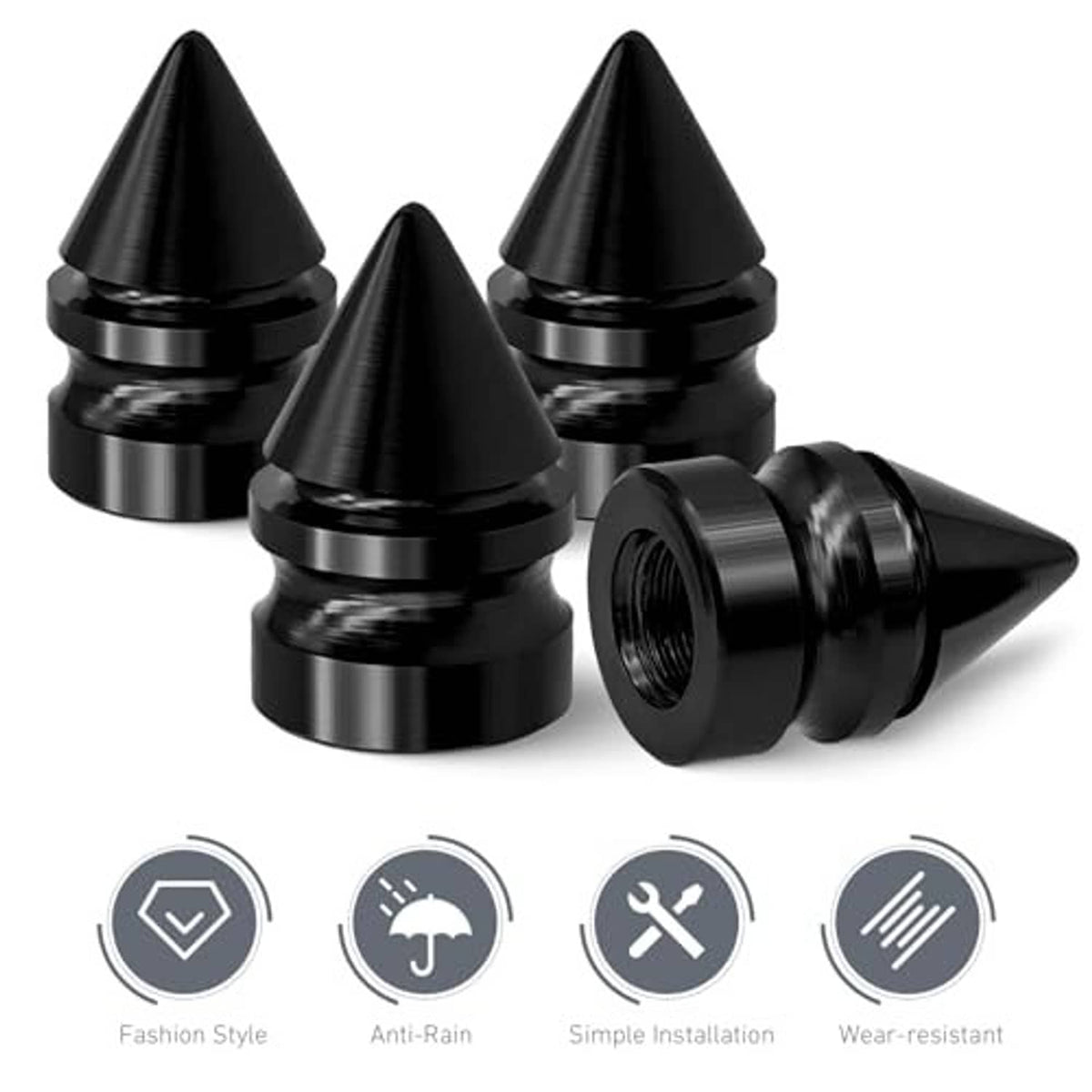 Set of 4 black spike tire valve stem caps, one shown detached