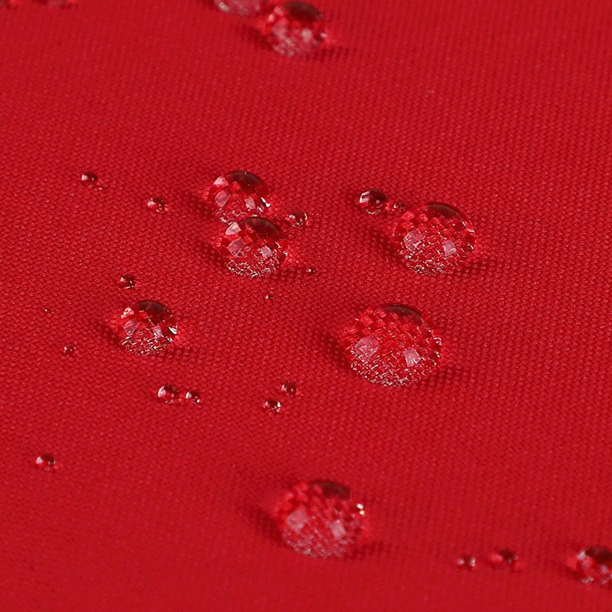 Red water-repellent shower curtain fabric with water droplets beading on surface