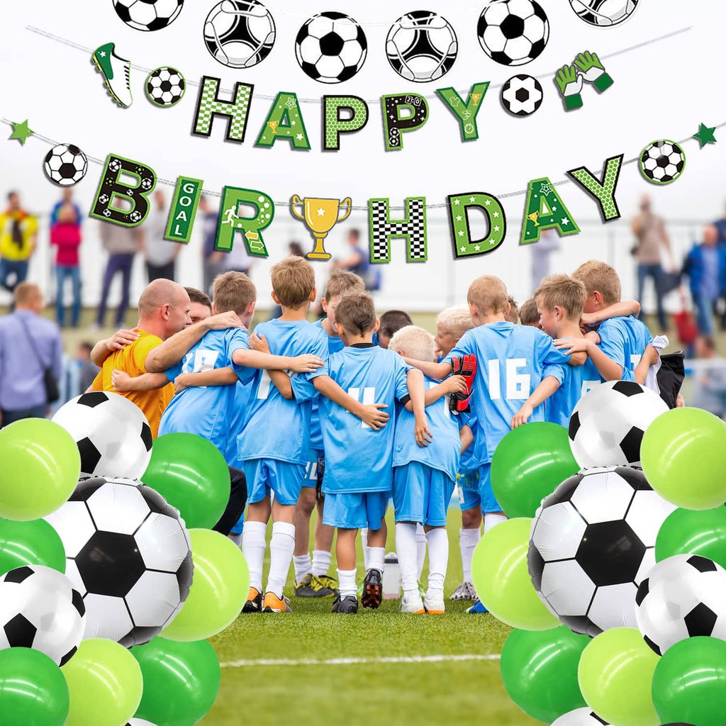 Soccer birthday banner above a team celebration, with green-and-white balloons around