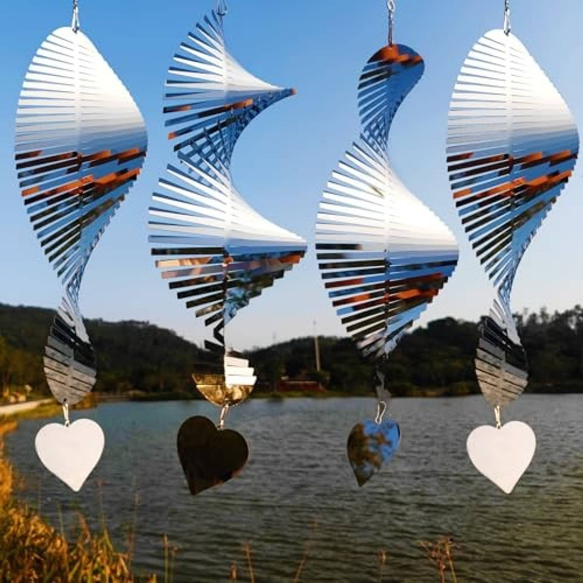 Bird deterrent mirror wind spinner with heart charms, reflective wing-like shape