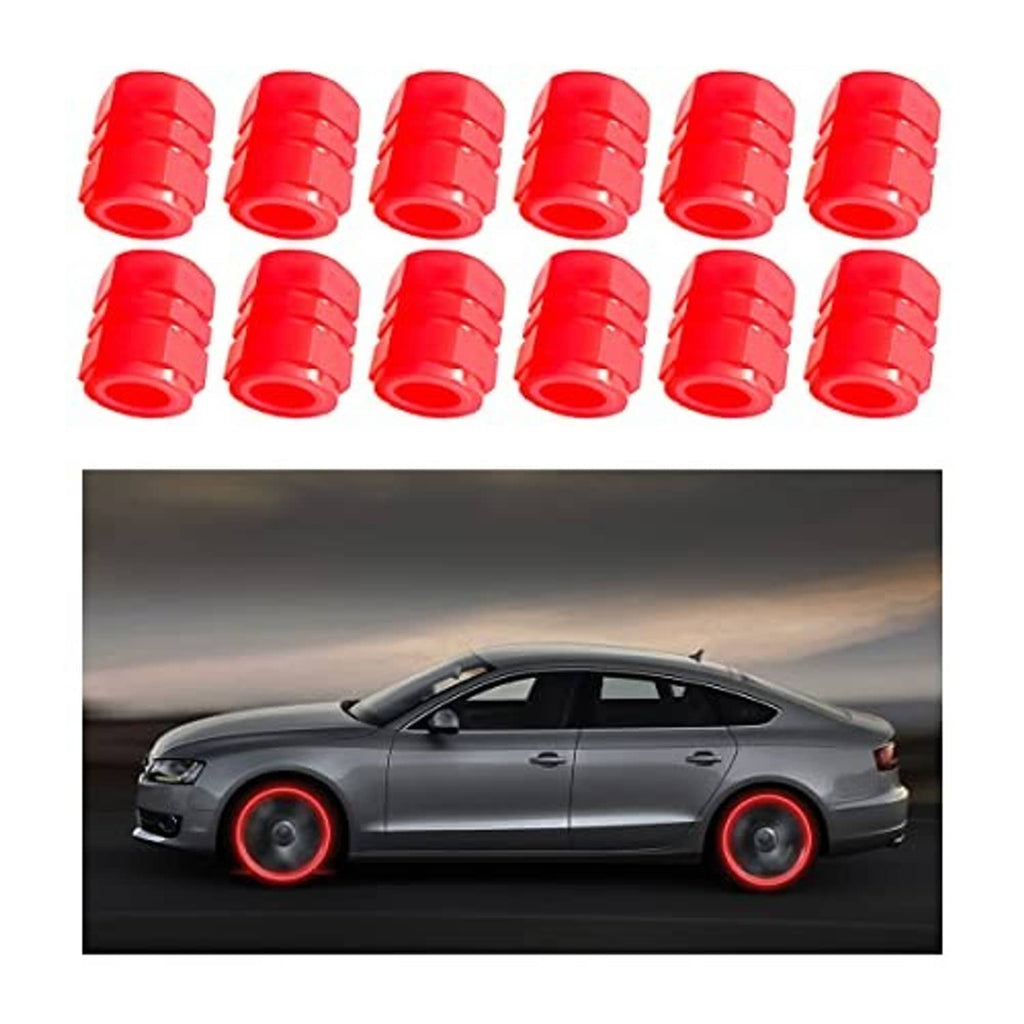 Twelve red tire valve stem caps in a row, with luminous wheel glow