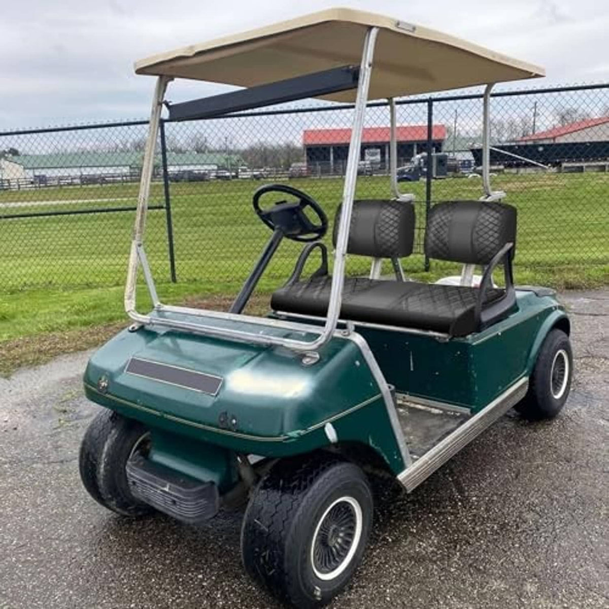 Installed black diamond-quilted golf cart front seat covers on outdoor cart