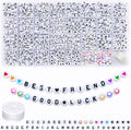 Acrylic alphabet letter beads in white with heart, star, and number charms—assorted in tray