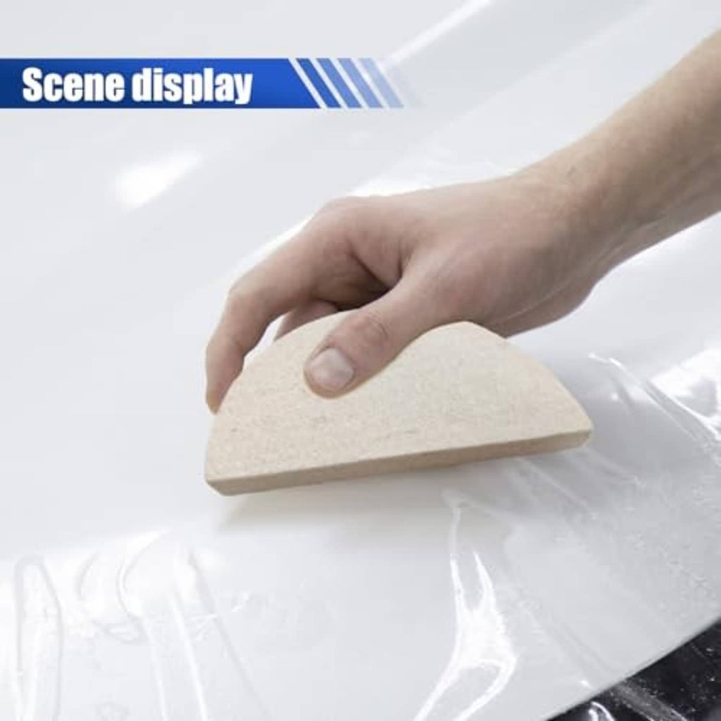 Hand using beige felt squeegee pad to press vinyl wrap flat