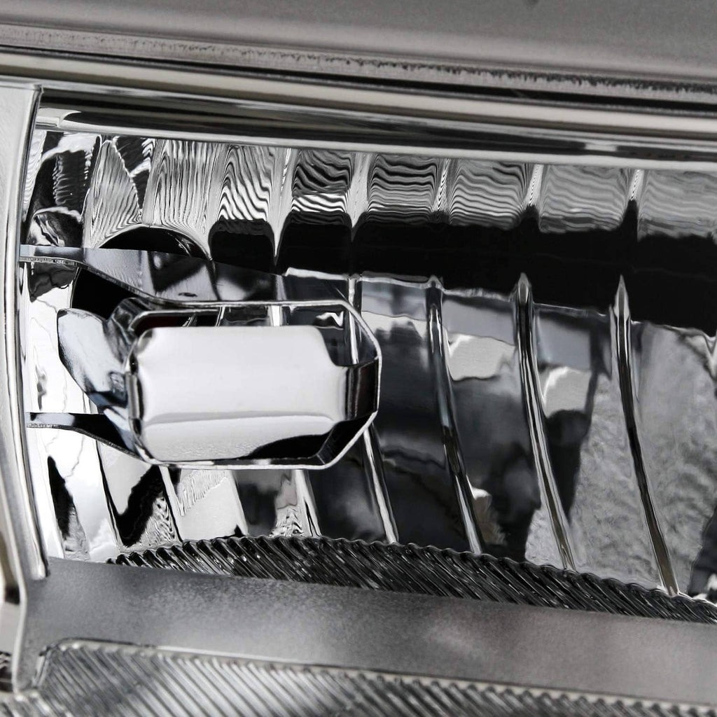 LED headlight reflector close-up with chrome housing interior and mounting bracket