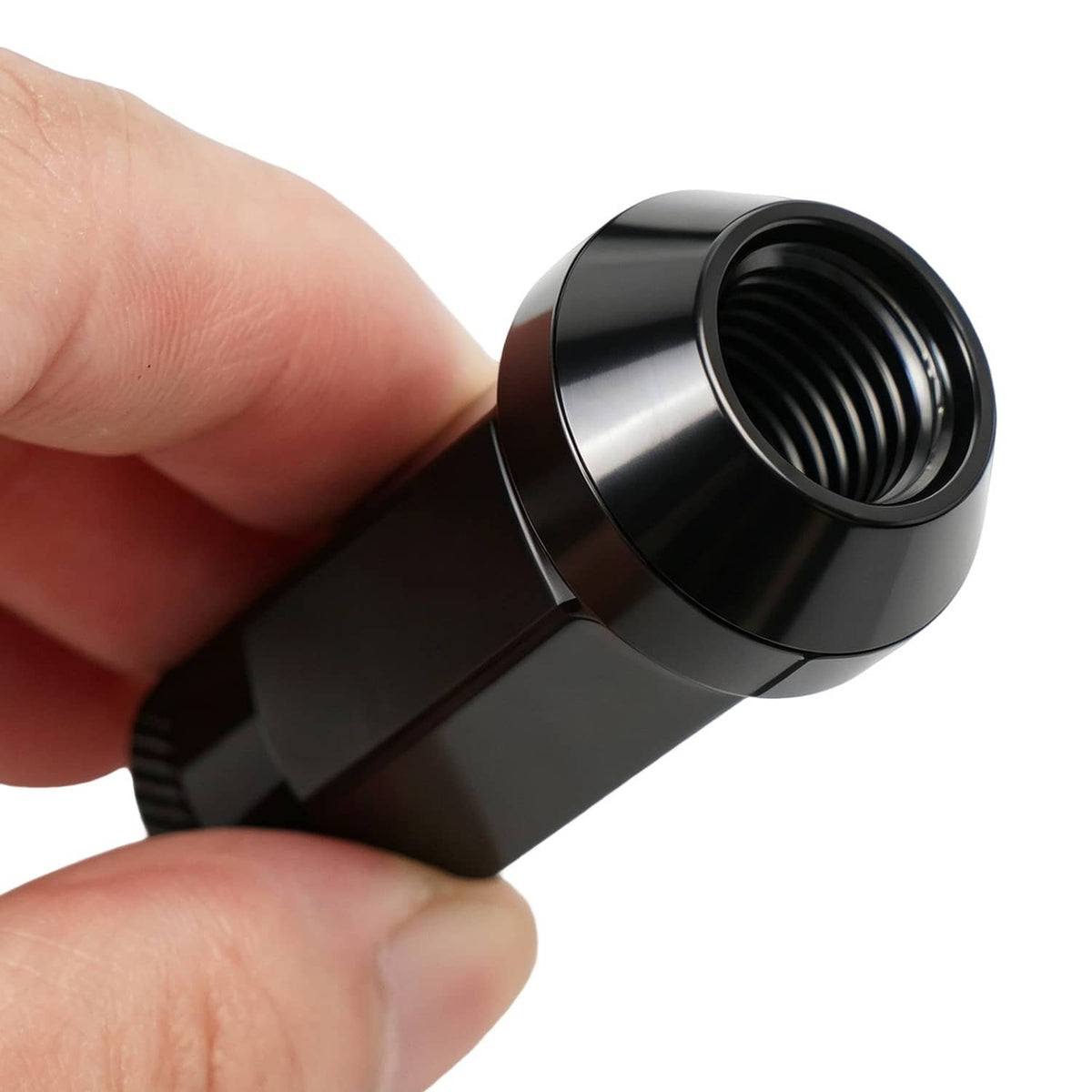 Black extended wheel lug nut with visible internal threading