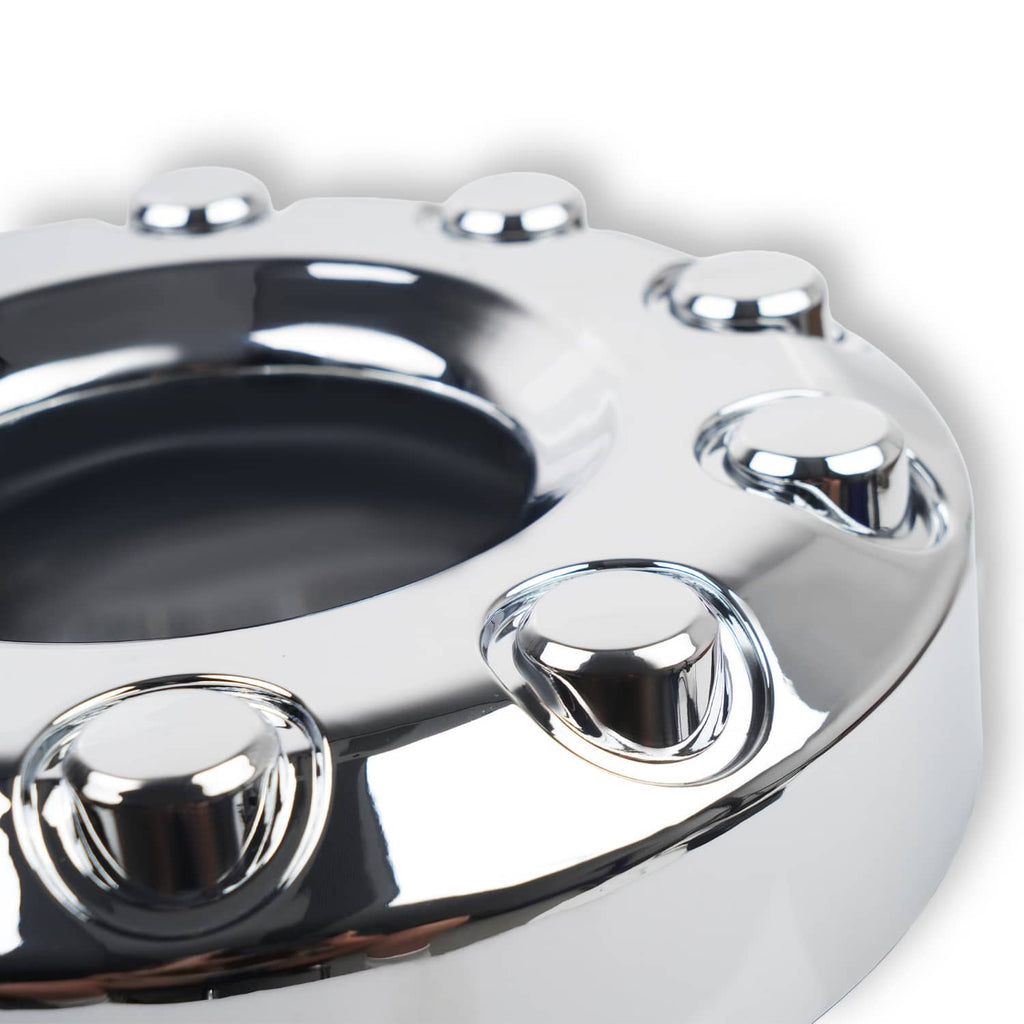Close-up of chrome wheel center hub cap with raised ring and bolt holes