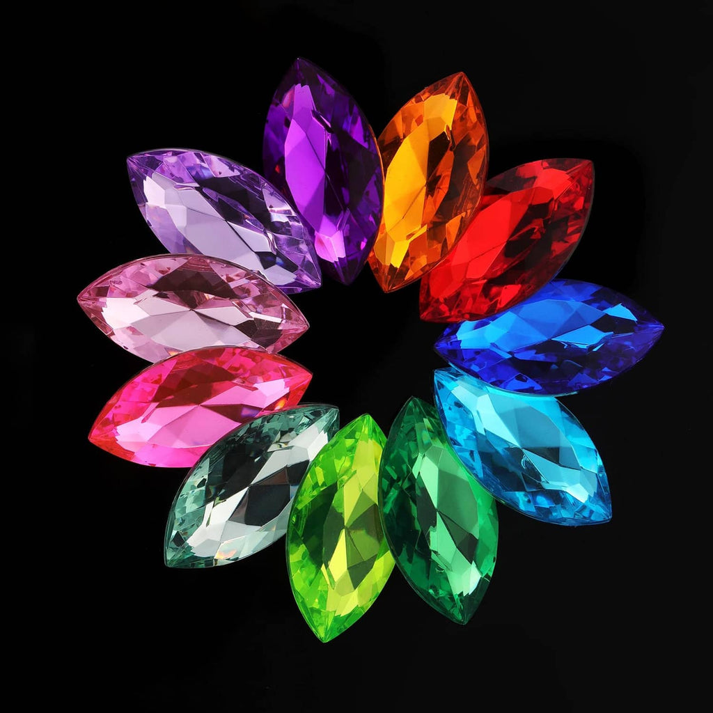 Cluster of multi-colored faceted jewel stones in marquise and teardrop shapes