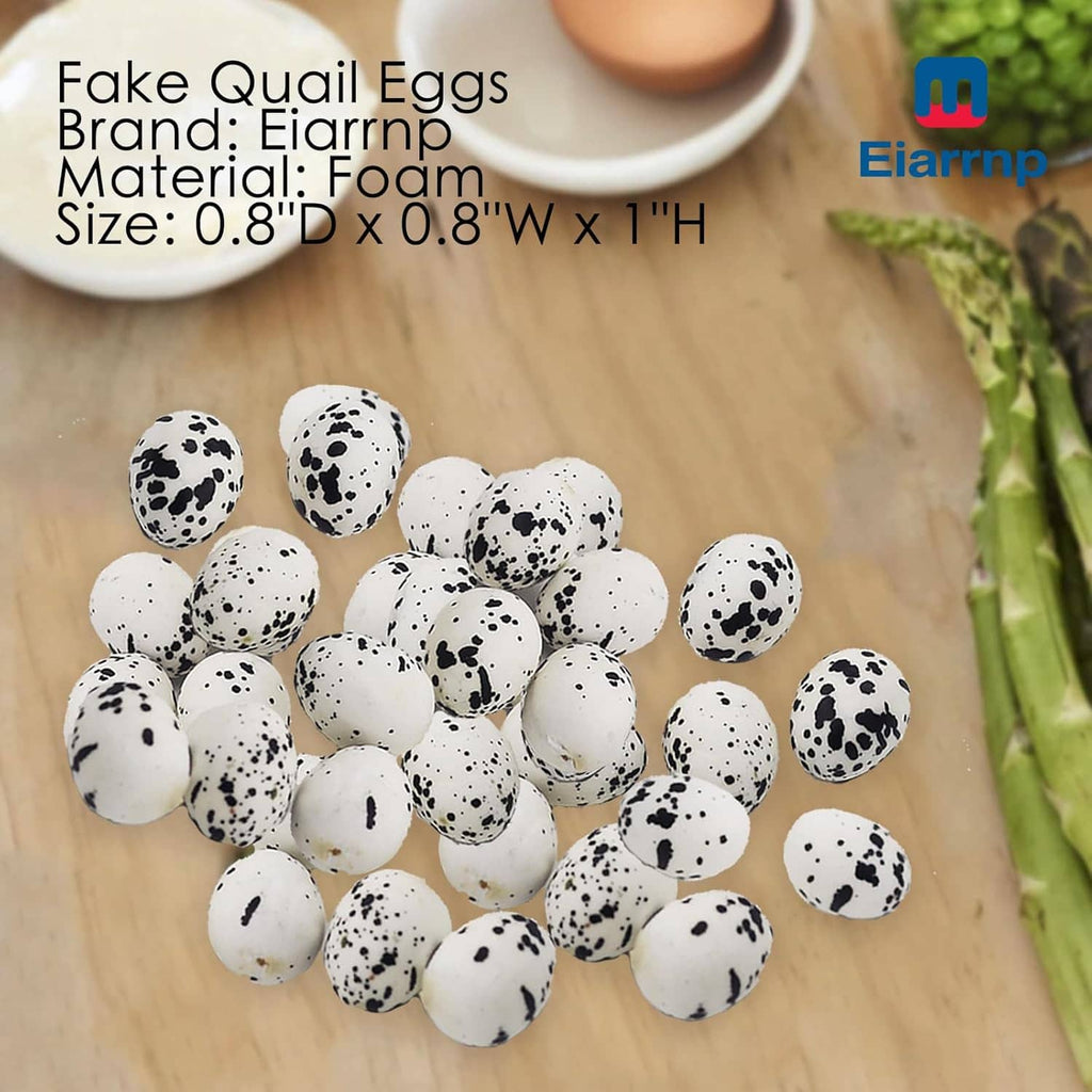 Artificial quail eggs on wooden tray, white shells with black speckles