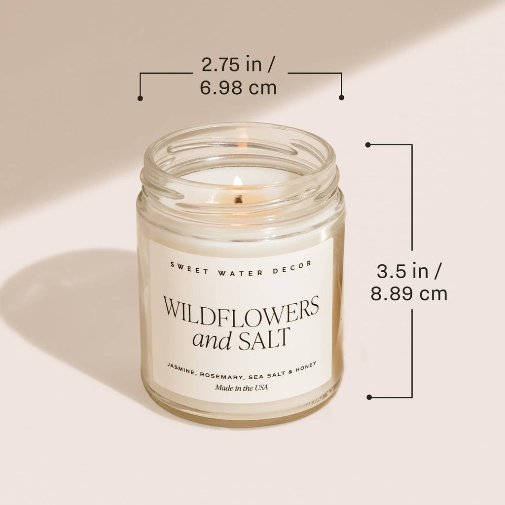 Glass jar candle labeled Wildflowers and Salt with height and width size markings