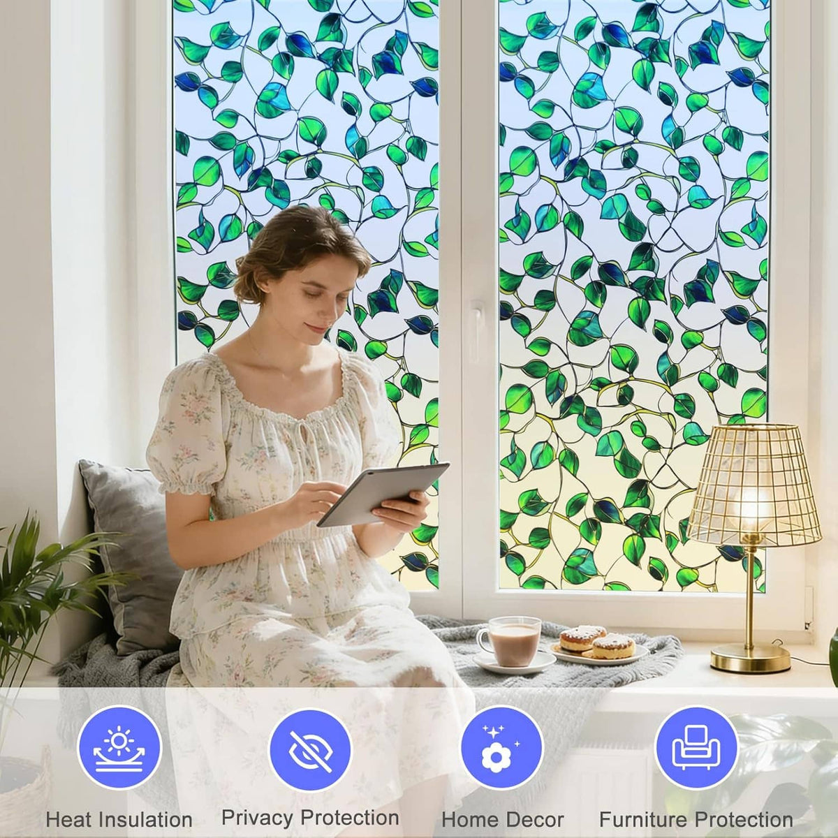 Window privacy film with green leaf stained-glass design across two side-by-side panes.