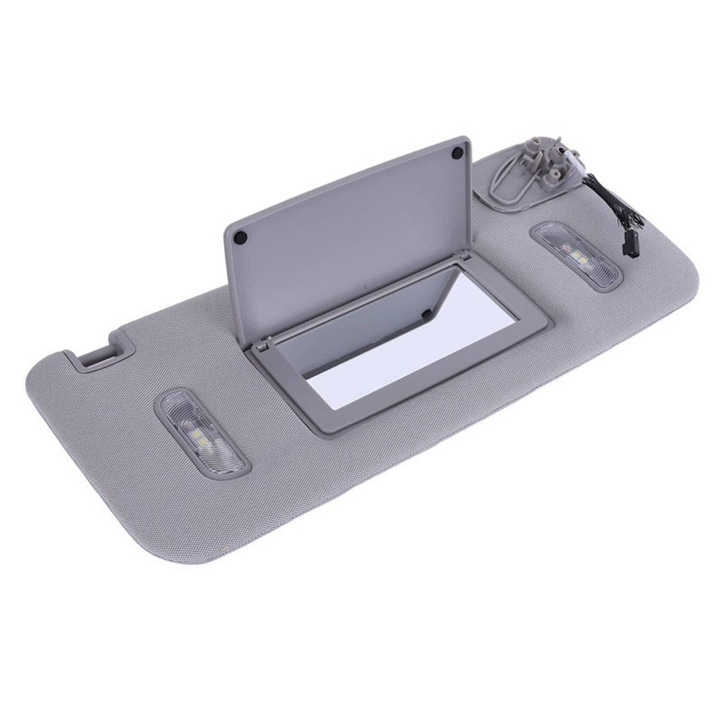 Grey sun visor panel open with rectangular mirror cutout and built-in light