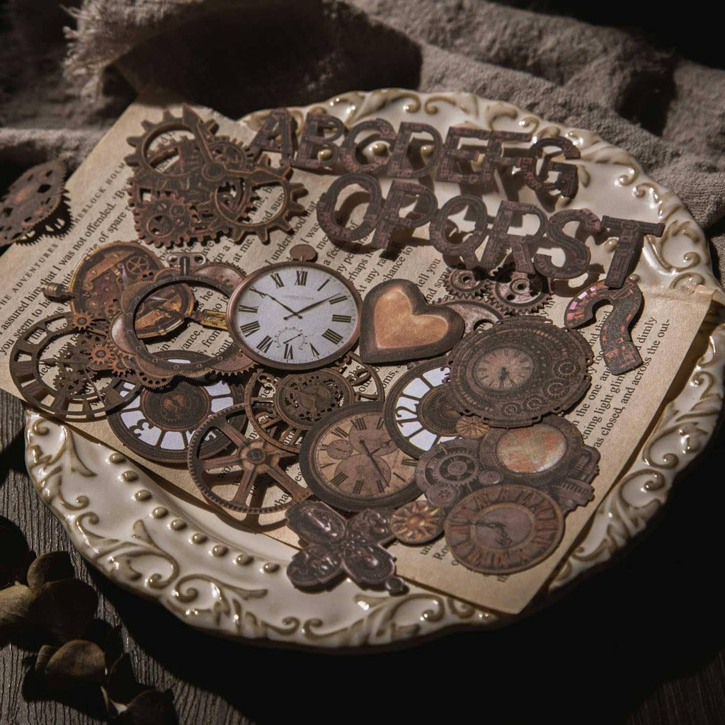 Steampunk junk journal bronze sticker set on ornate backing with hearts, gears, and clock faces