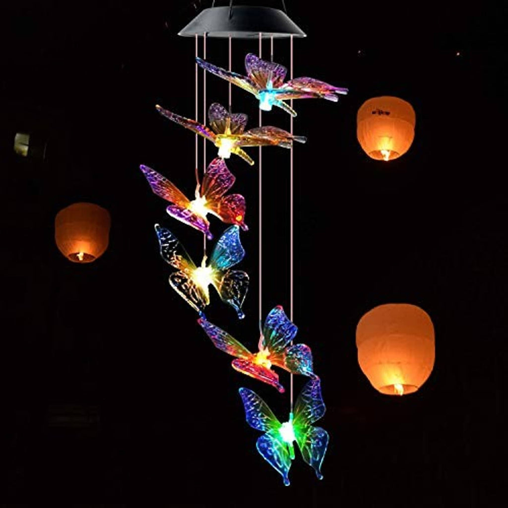 Solar wind chime with multicolor glowing butterflies hanging from vertical metal rods