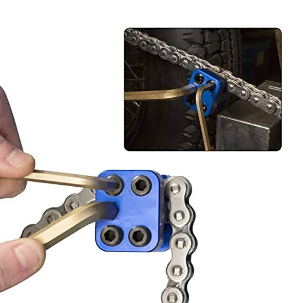 Blue chain link press tool clamping a motorcycle chain link with handle tool