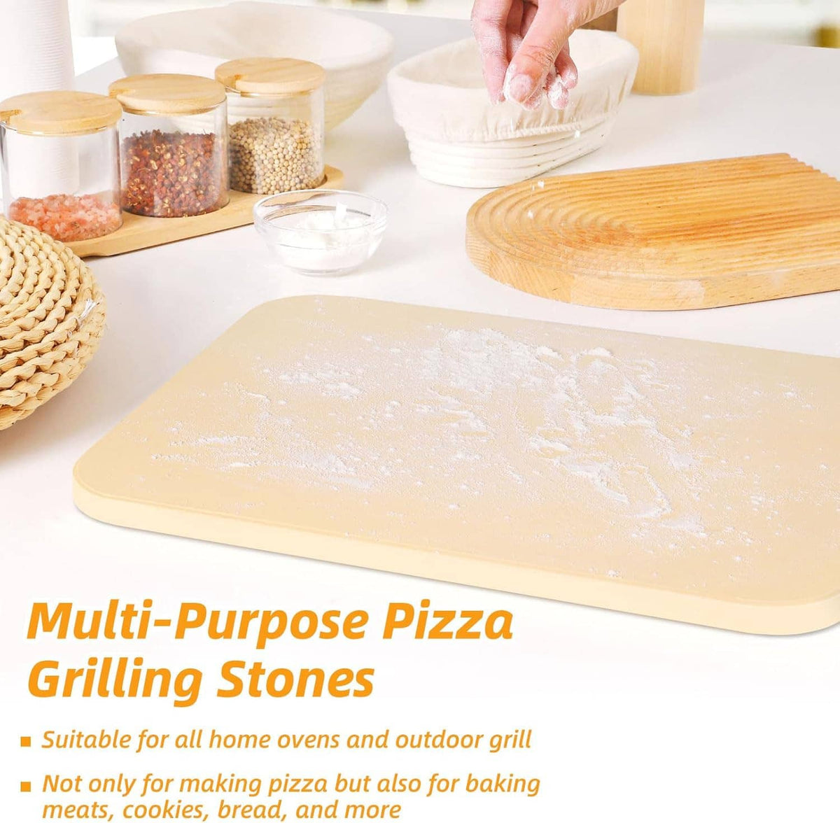 Rectangular beige pizza grilling stone on a countertop with baking accessories