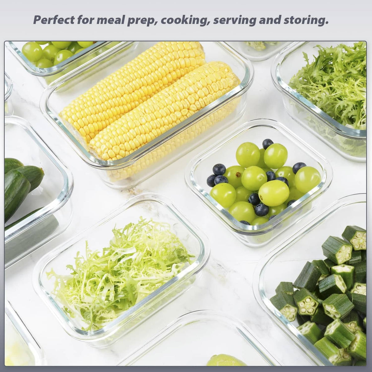 Clear glass meal prep containers with gray lids holding corn, grapes, and greens
