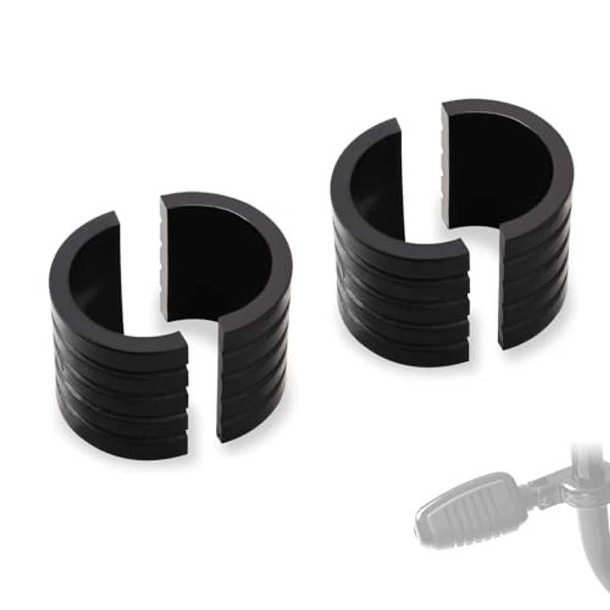 Set of black motorcycle highway peg mount spacers with rubber insert sleeves and ridges