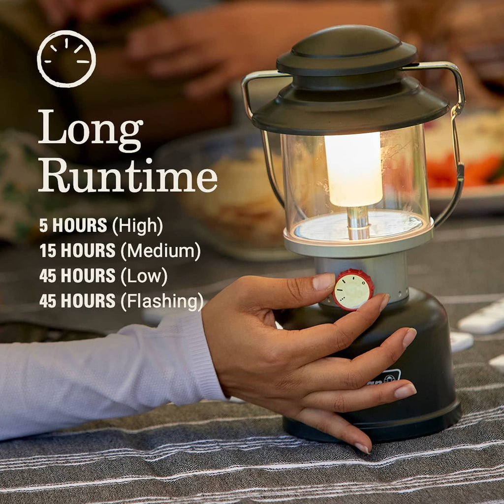 Black lantern with red control dial and clear glass-style shade, glowing during use.