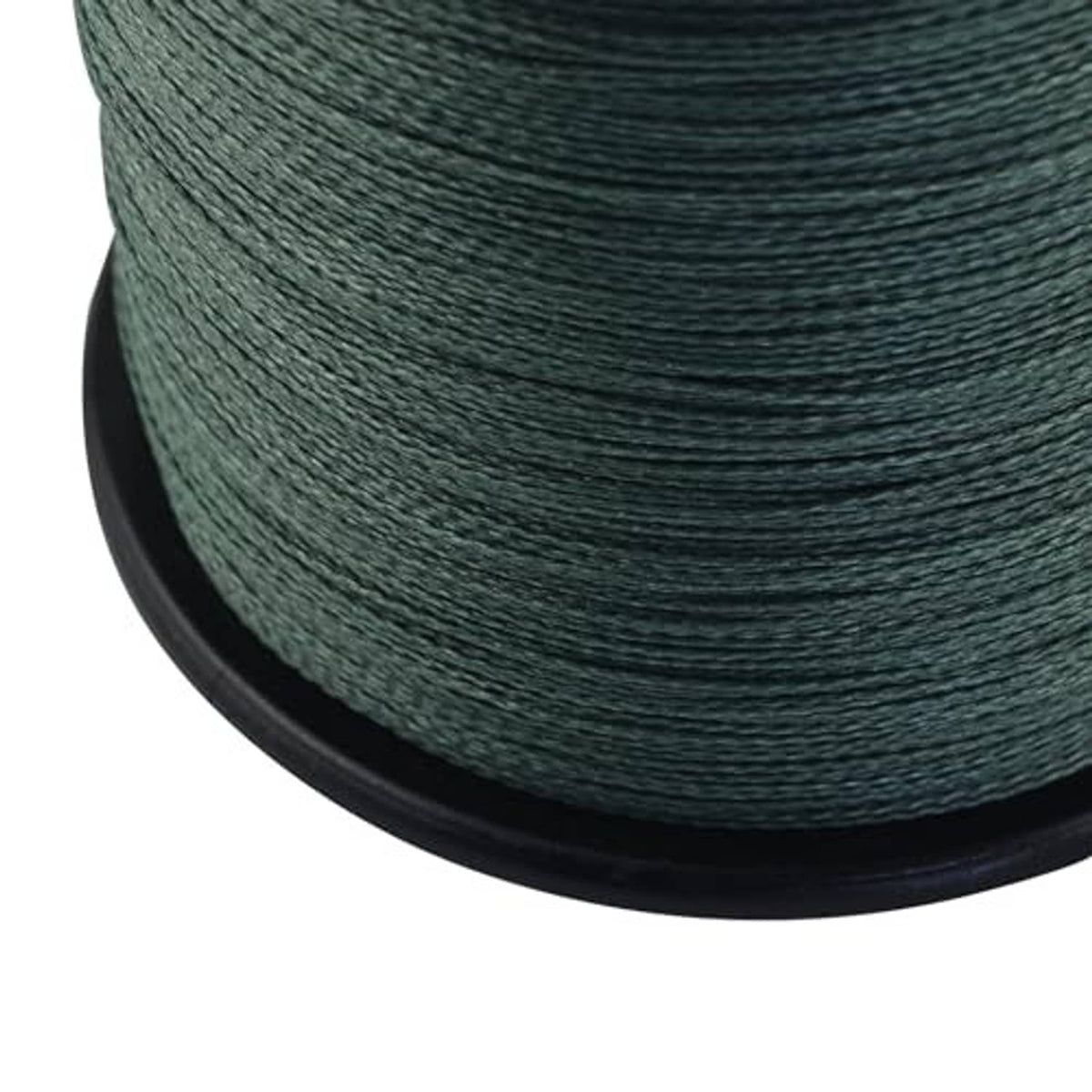Close-up of green braided fishing line on spool