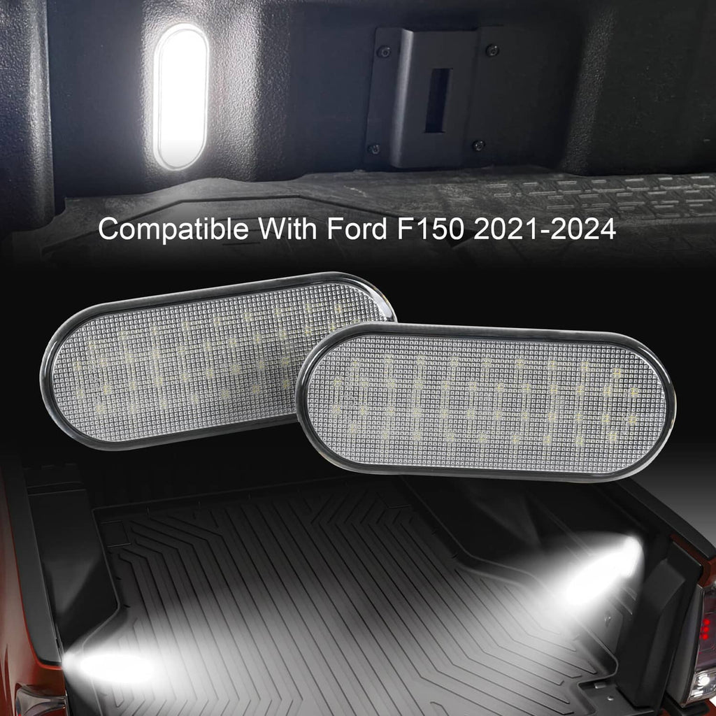 Pair of oval LED bed lights illuminating truck bed with clear lens housings