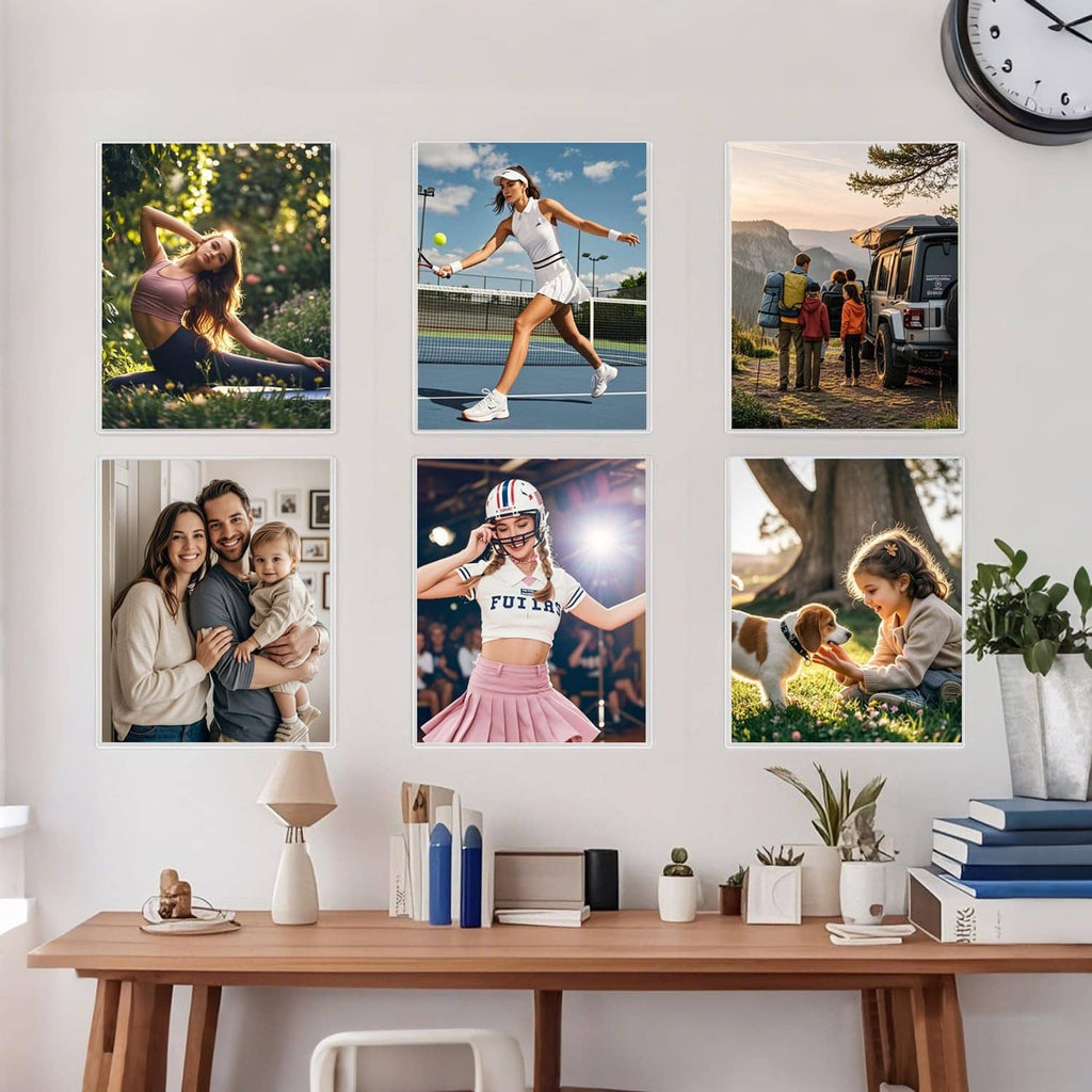 Set of clear rigid photo sleeves displayed on a table with multiple framed pictures