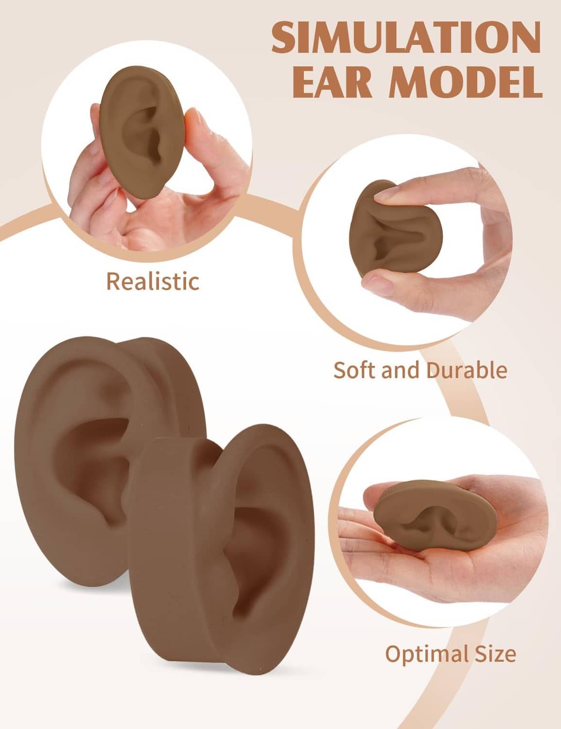 Two dark brown silicone ear models held in hands, realistic ear shape with inner details