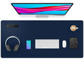 Dark blue desk pad protector with smooth faux leather surface and rounded corners