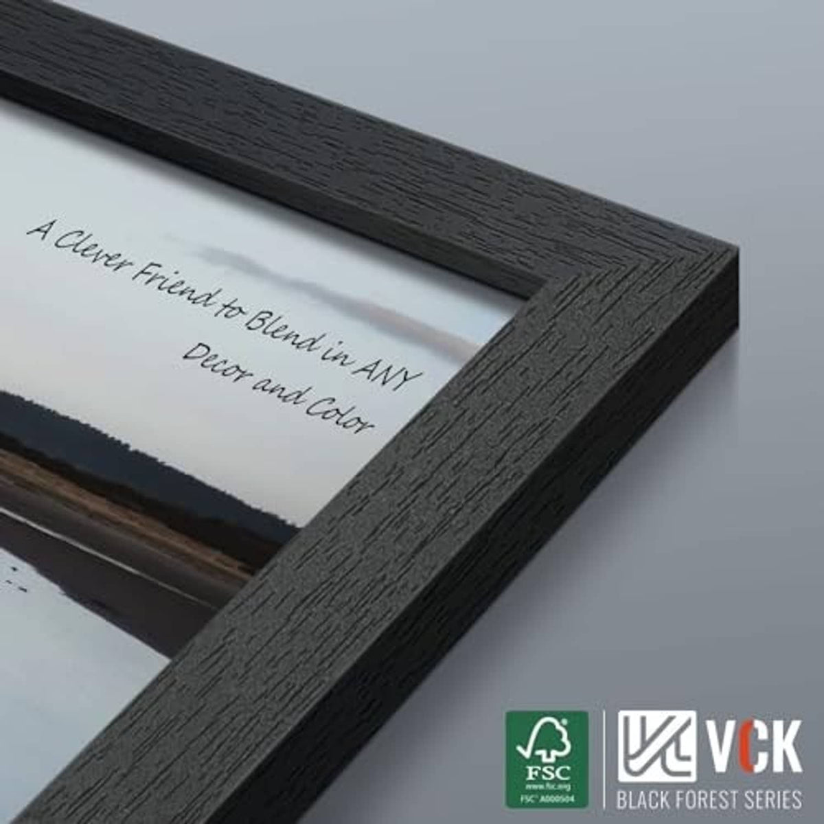 Black wood picture frame corner detail with textured finish