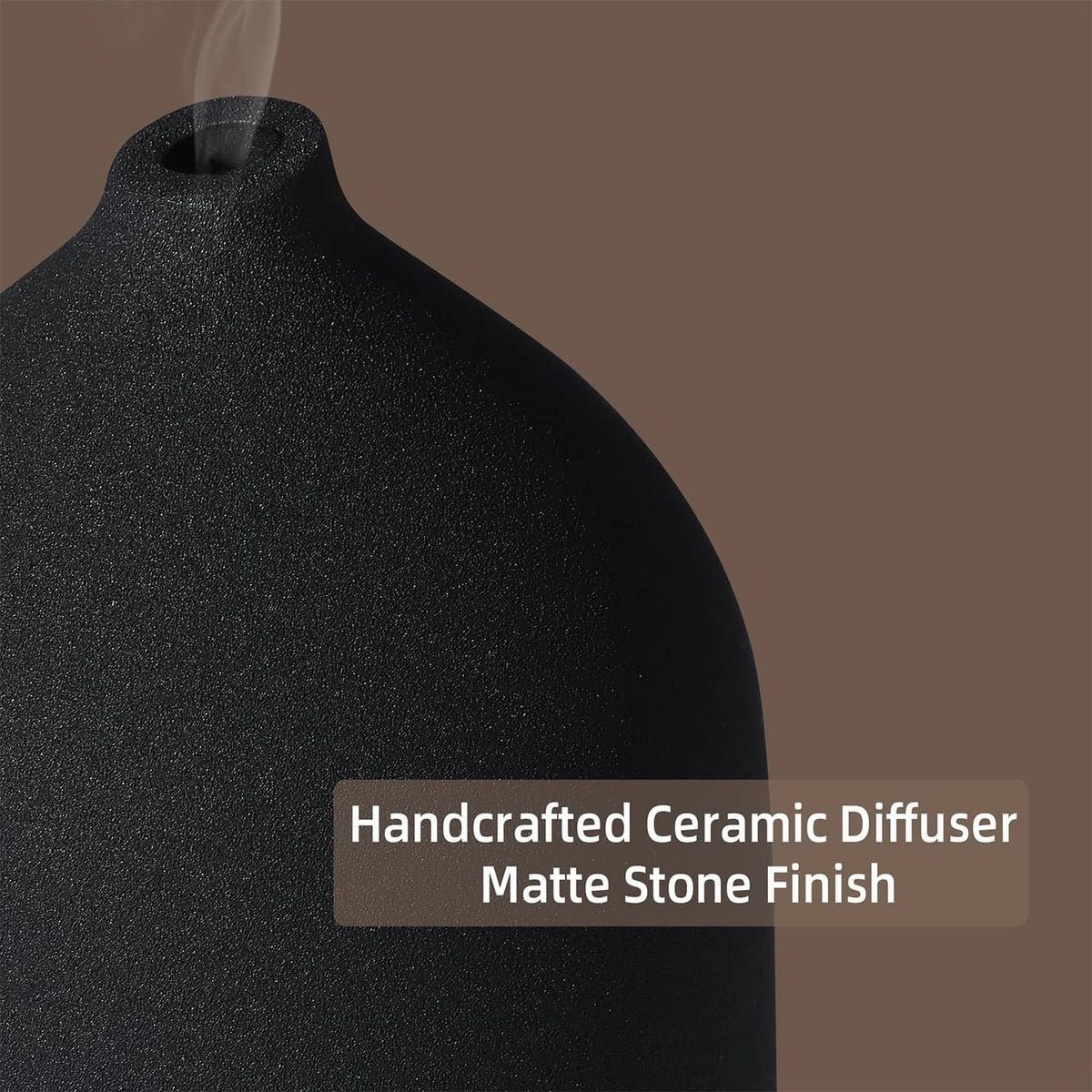 Black ceramic diffuser with textured matte finish, close-up of top opening