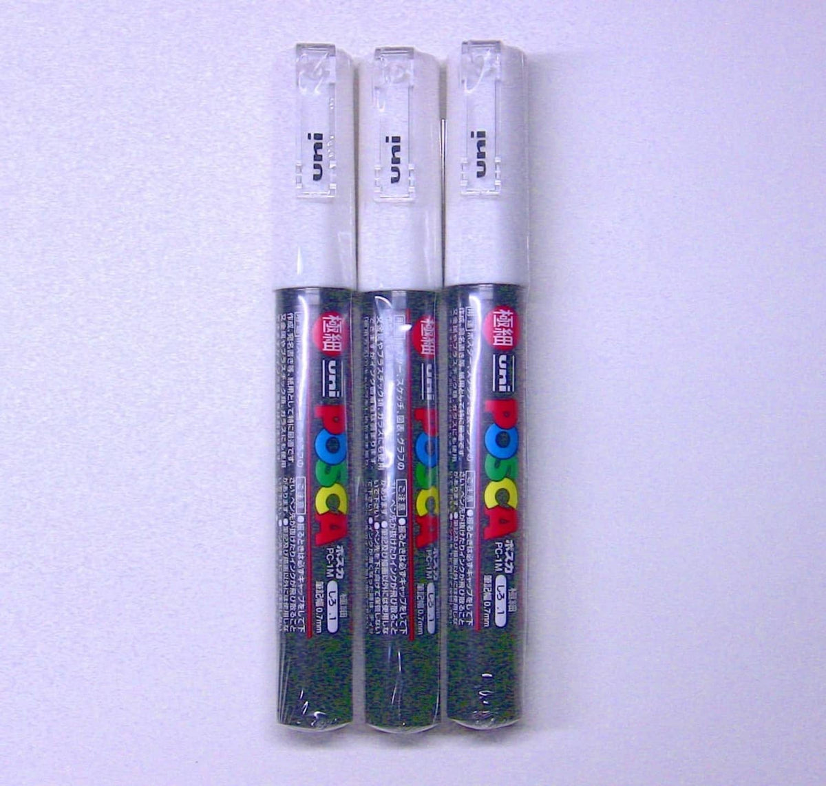 Triple set of Uni Posca PC-1M white paint markers in clear plastic caps