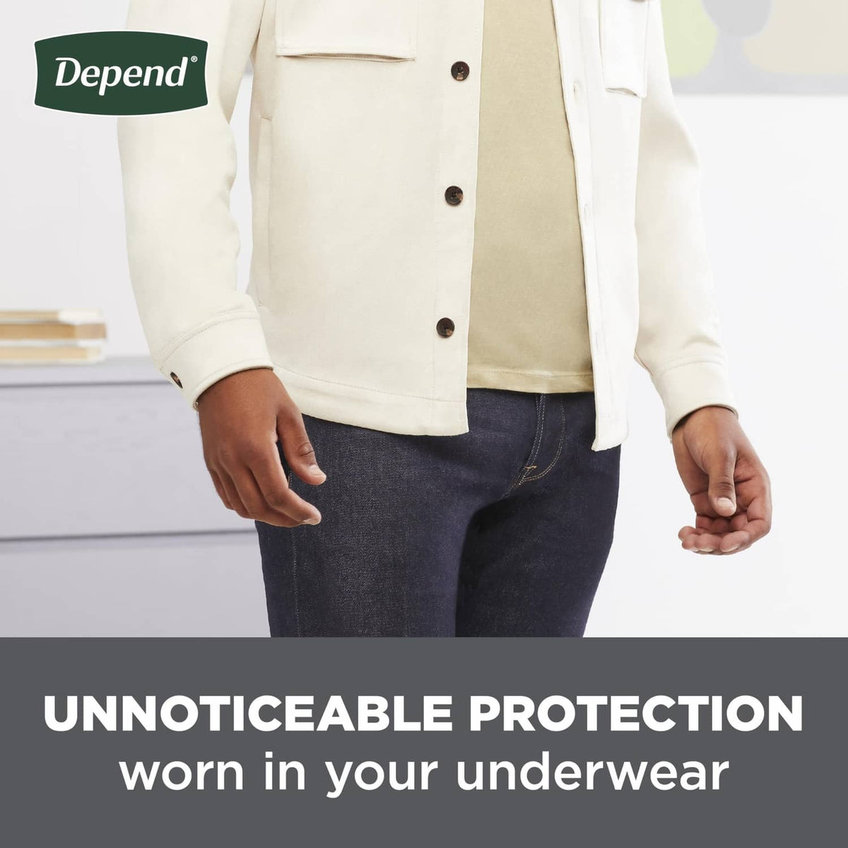 Man wearing jeans with protective guards underneath, no pad visible from the front