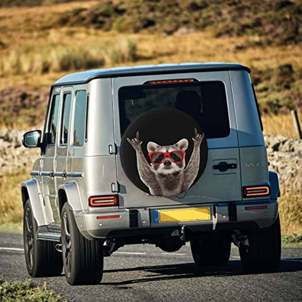 Black spare tire cover with raccoon face in red glasses on rear wheel