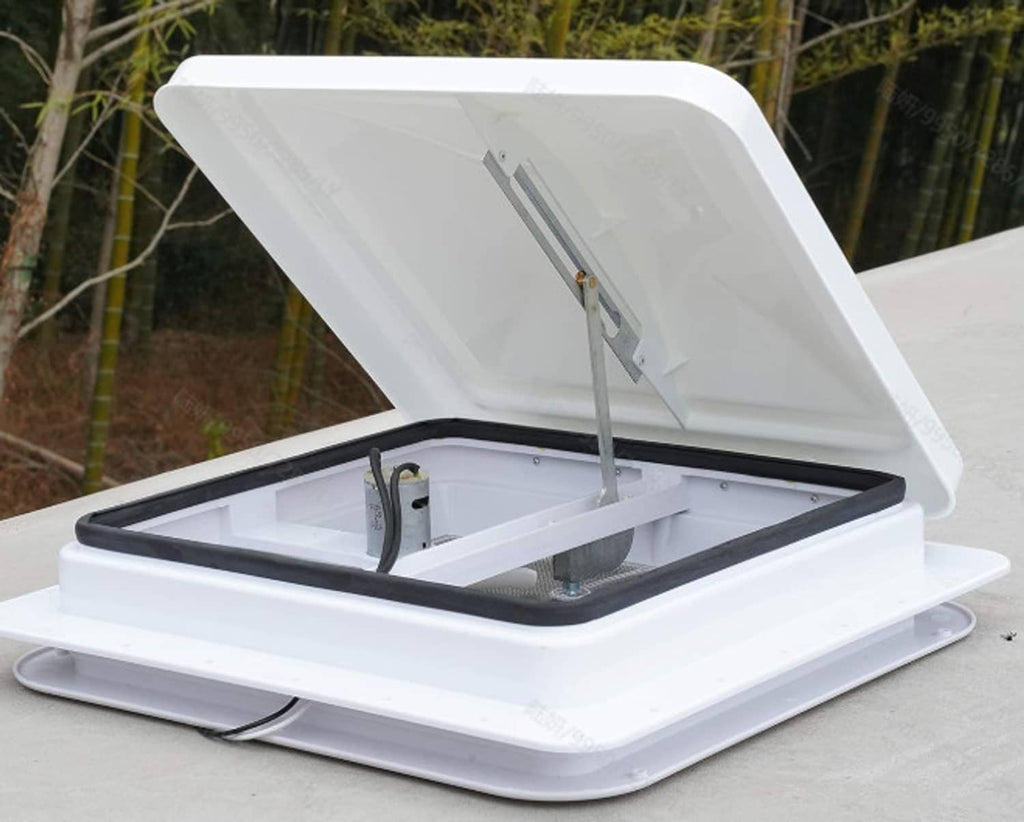 White RV roof vent cover open on roof, showing hinge and mounting frame