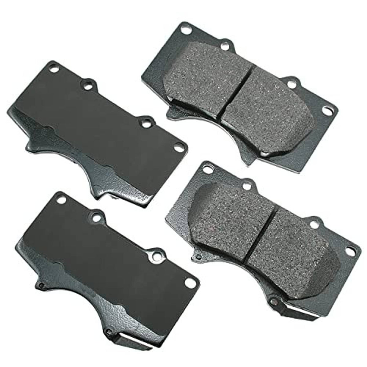 Brake pad set showing four dark grey brake pads with mounting holes