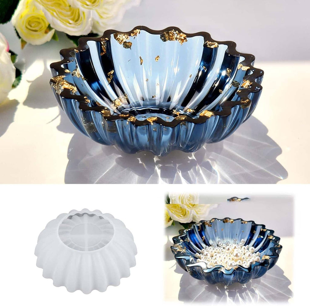 Blue resin bowl with scalloped edges and gold accents, flower tray style