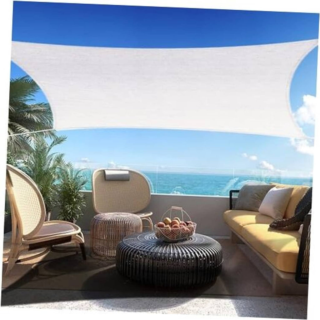 Off-white rectangular sun shade sail canopy with curved edges, stretched outdoors.