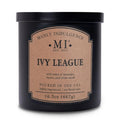 Black scented candle jar with kraft label and gold 'Ivy League' emblem