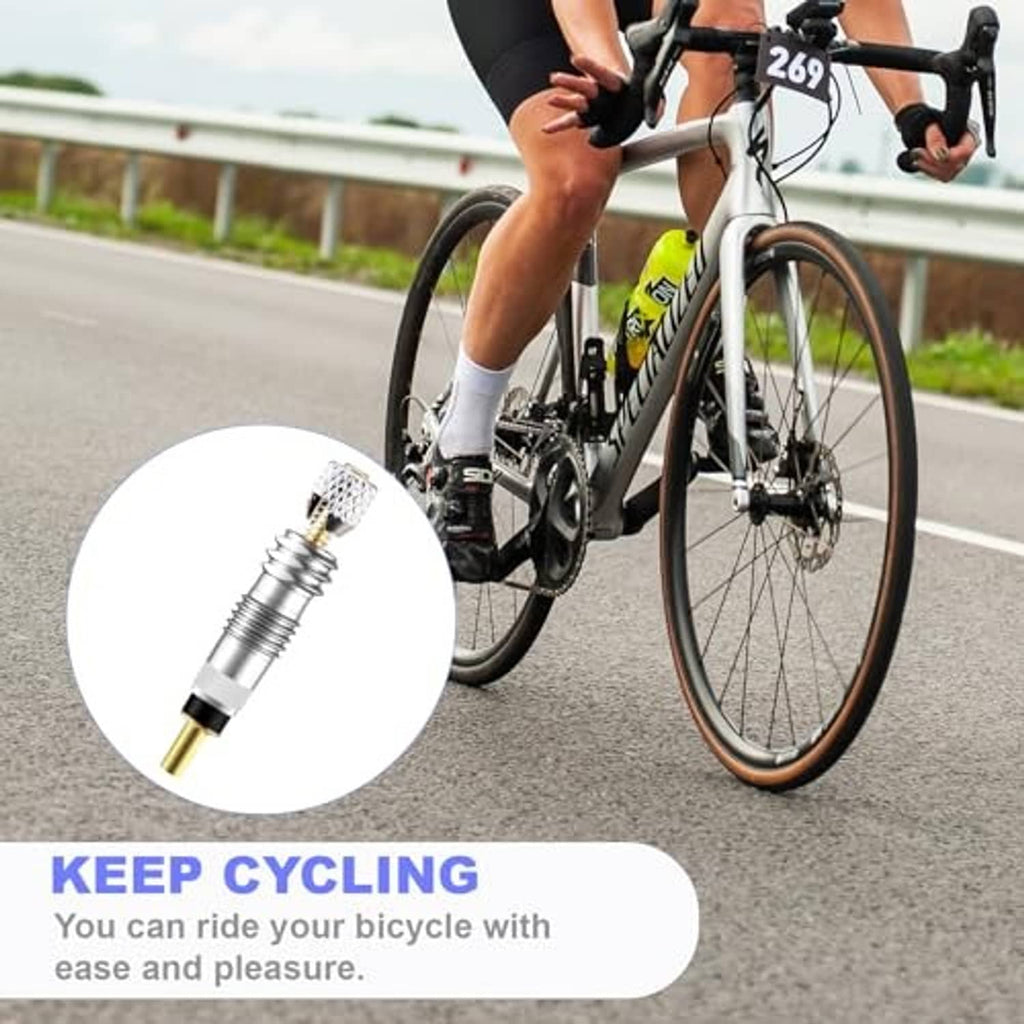 Presta valve core with gold inlet shown on bicycle wheel, chrome valve body
