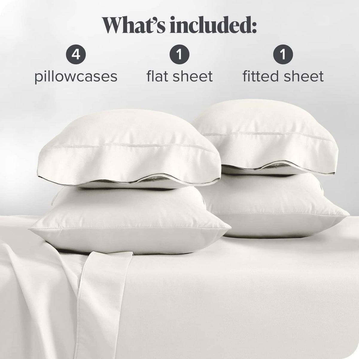 Cream microfiber pillowcases and sheets set displayed with folded bedding pieces