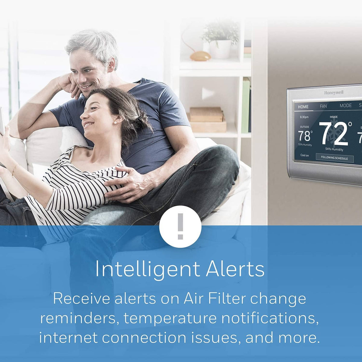 Honeywell Home gray wall thermostat with touchscreen showing indoor/outdoor readings