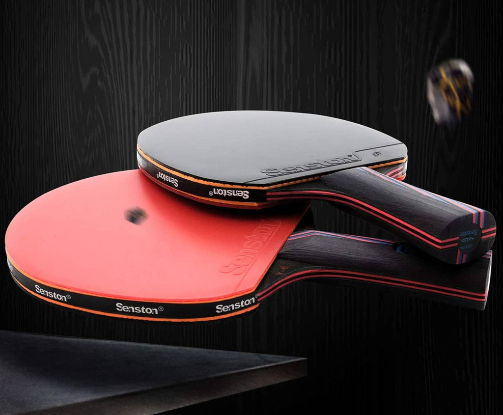 Table tennis paddle set with pink and gray faces and red-black handles