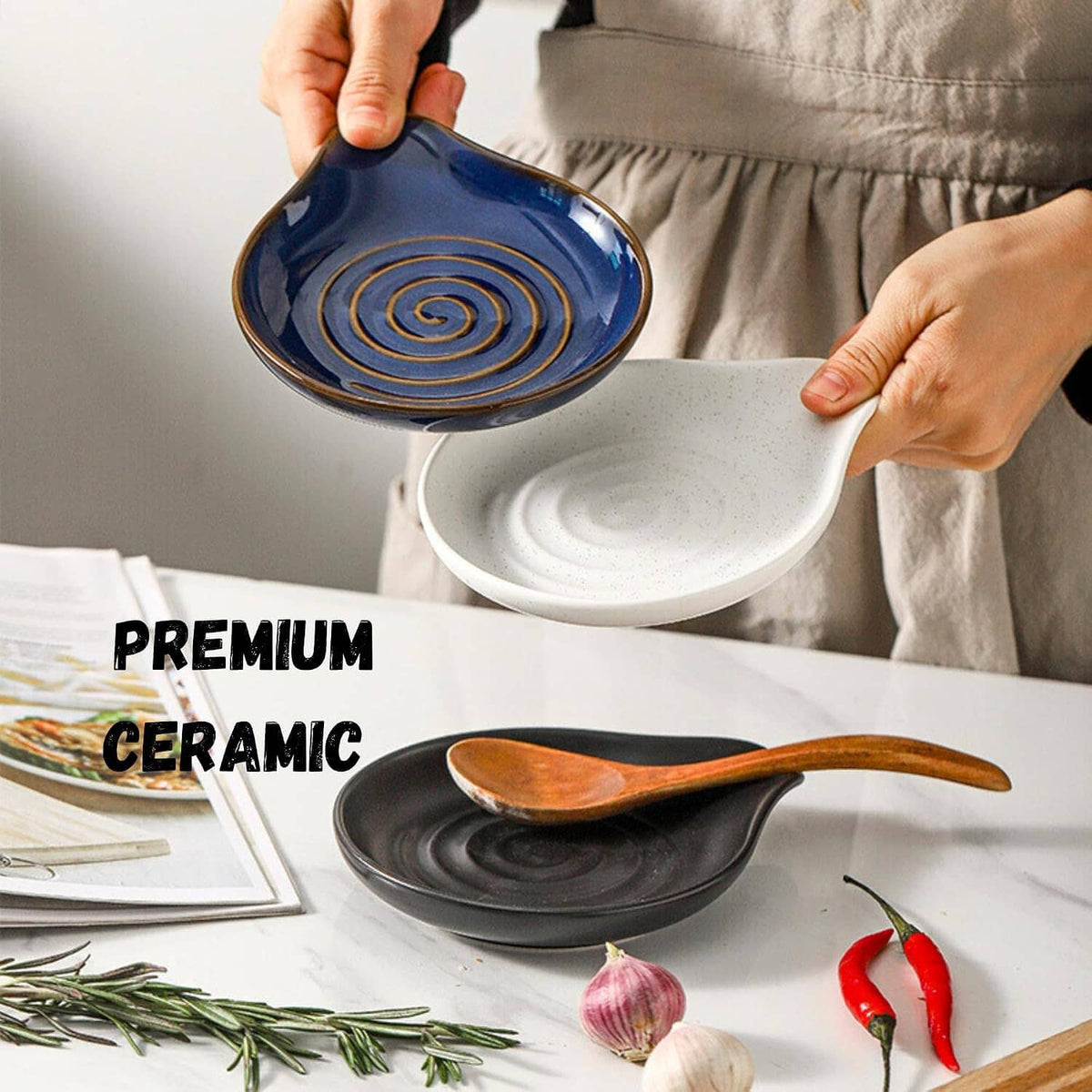 Blue ceramic spoon rest with spiral swirl base holding a wooden spoon