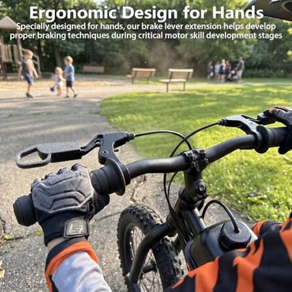Black brake lever extensions on handlebars with rider hands near brakes