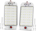 LED dome light pair with clear white lens and red circular switch on front
