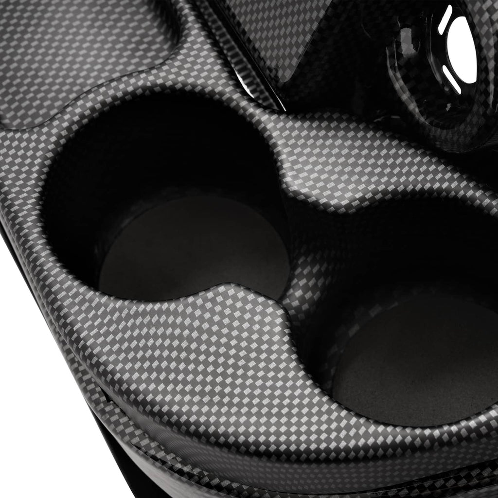 Close-up of black carbon fiber style dashboard cover with contoured cup holder openings