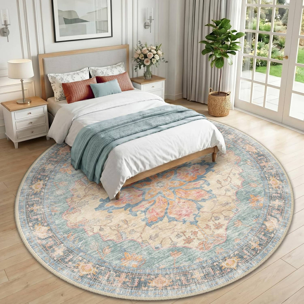 Round washable area rug with blue, orange, and red floral medallion pattern